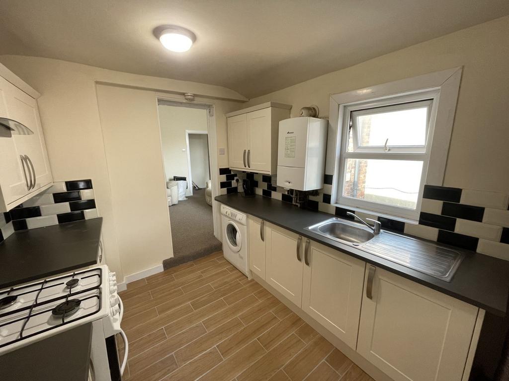 Bright and functional kitchen with ample natura...