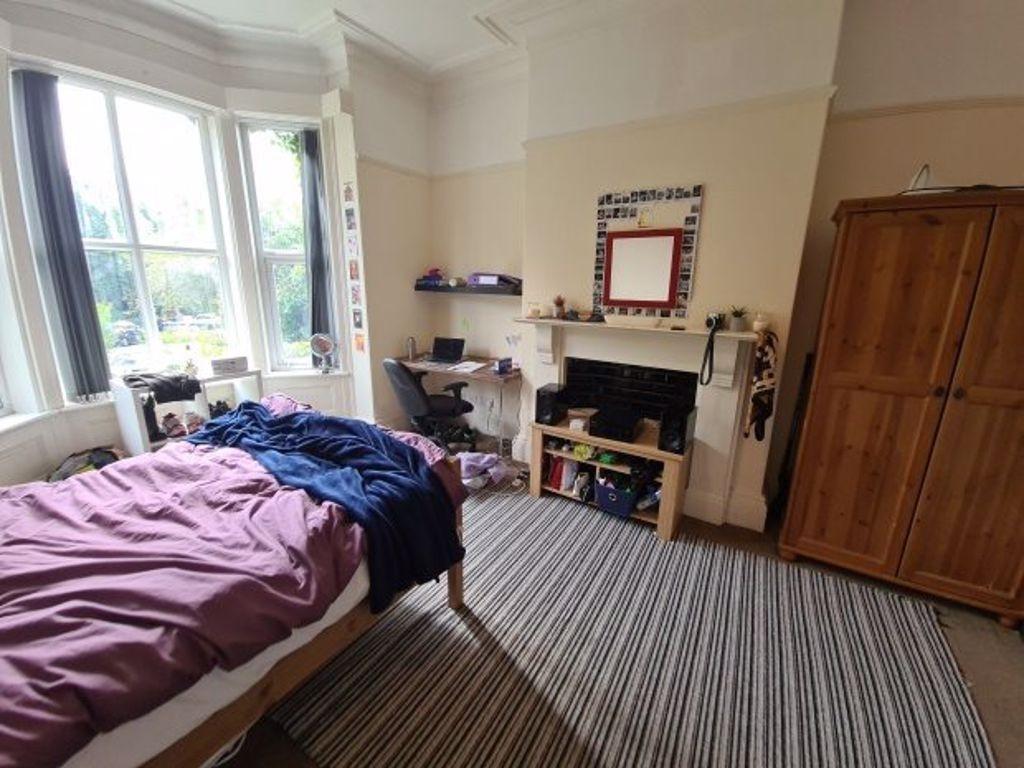 A bright and welcoming double bedroom featuring...