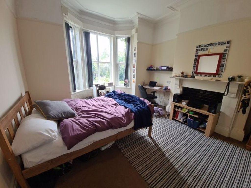 A cozy double bedroom featuring a comfortable d...