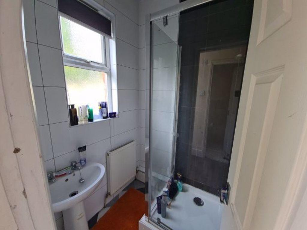 A clean and functional bathroom featuring a bri...