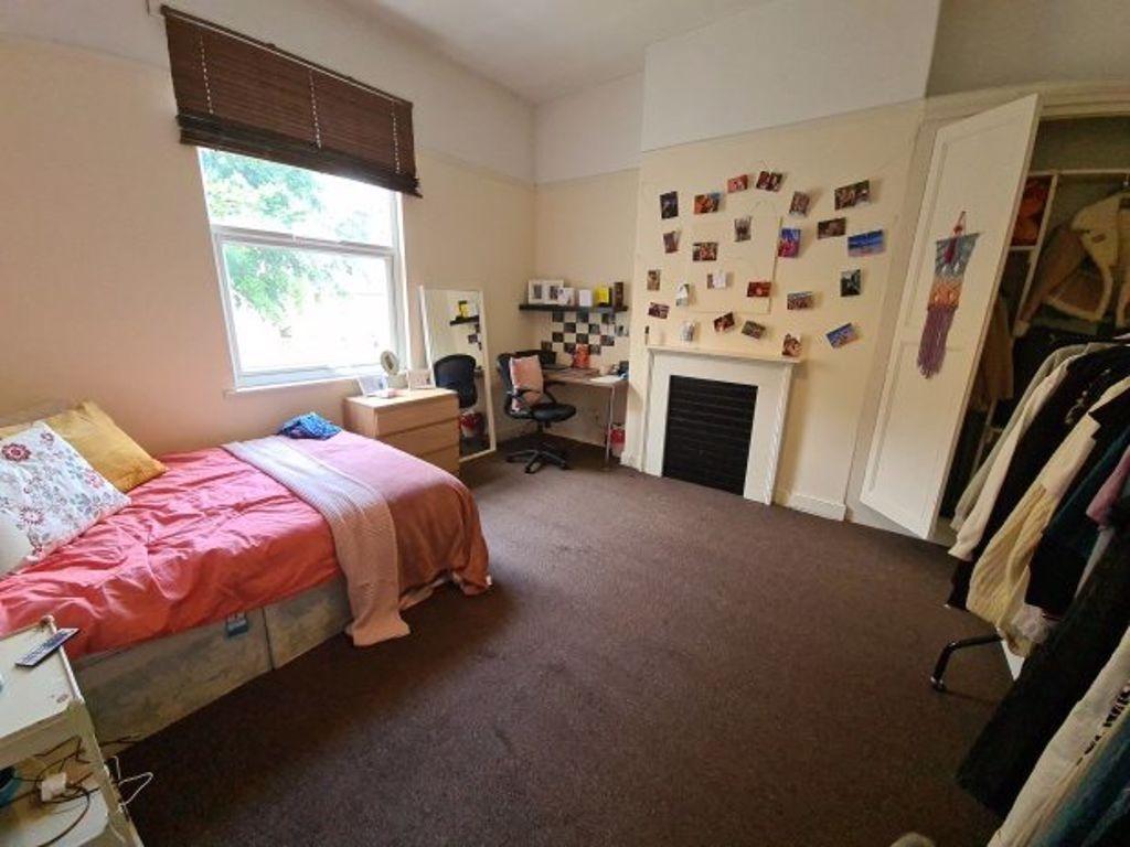 Bright and cozy single bedroom featuring a comf...