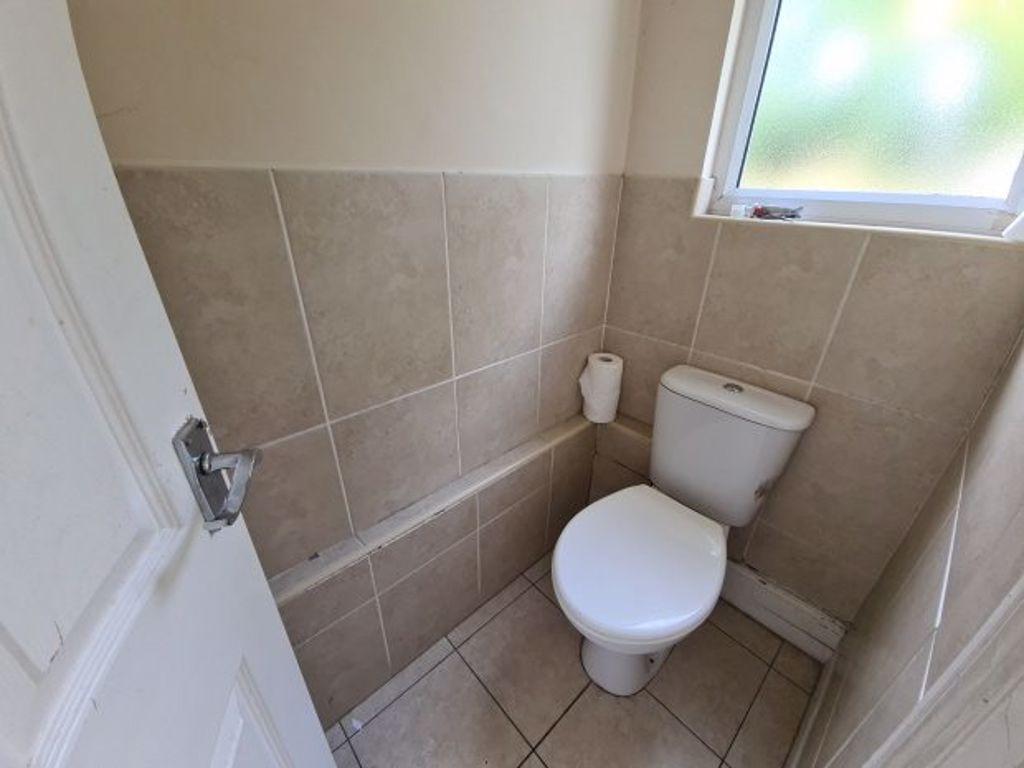 A clean and well-maintained small toilet room f...