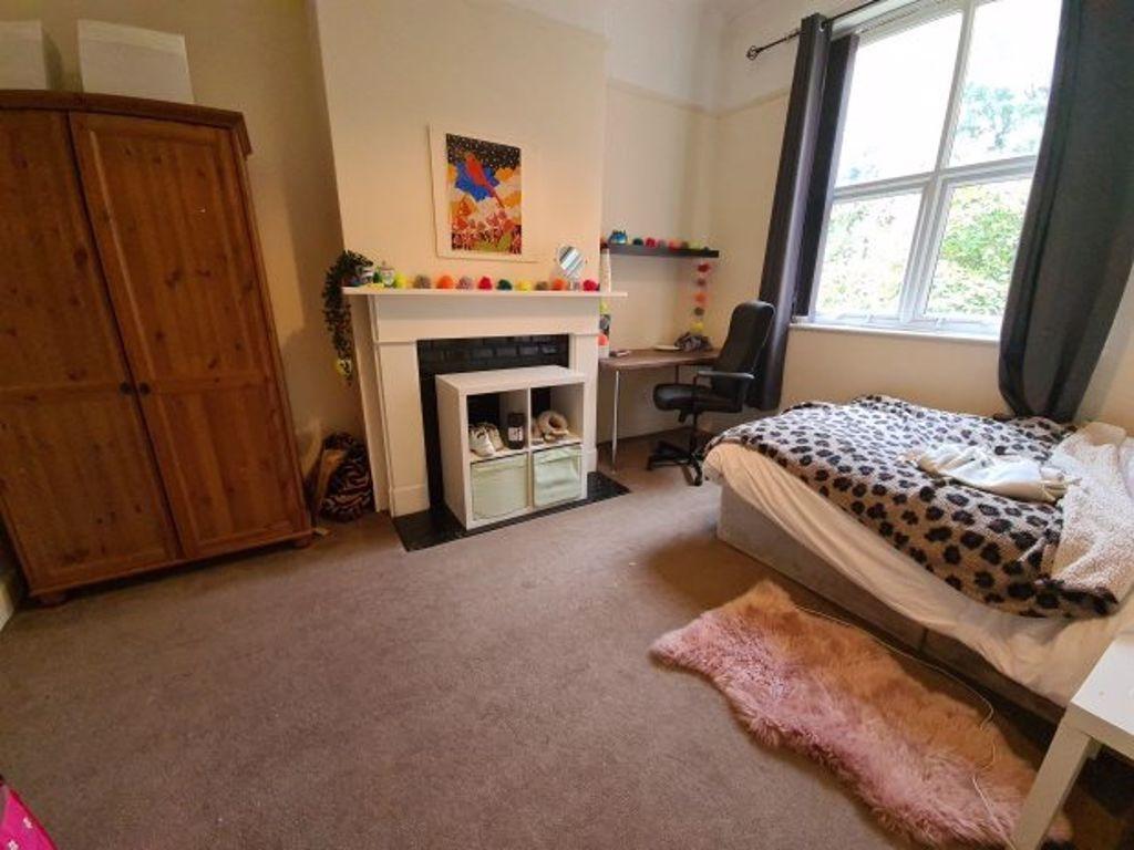 Bright and cozy double bedroom featuring a comf...