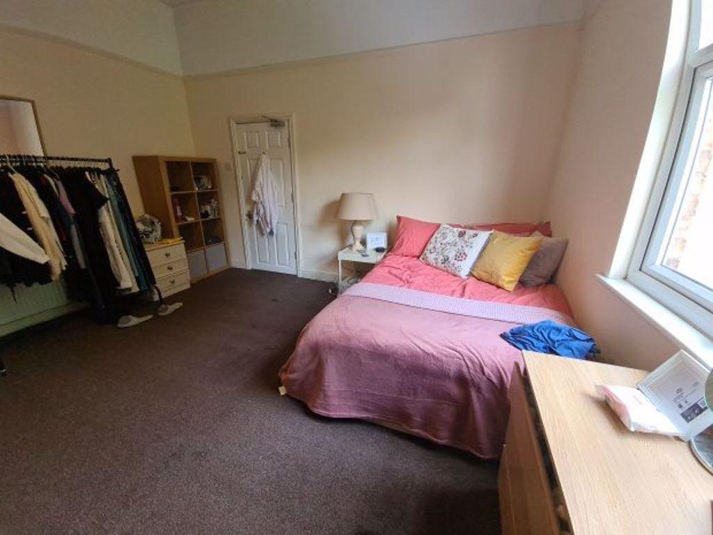 Bright and cozy double bedroom featuring a larg...