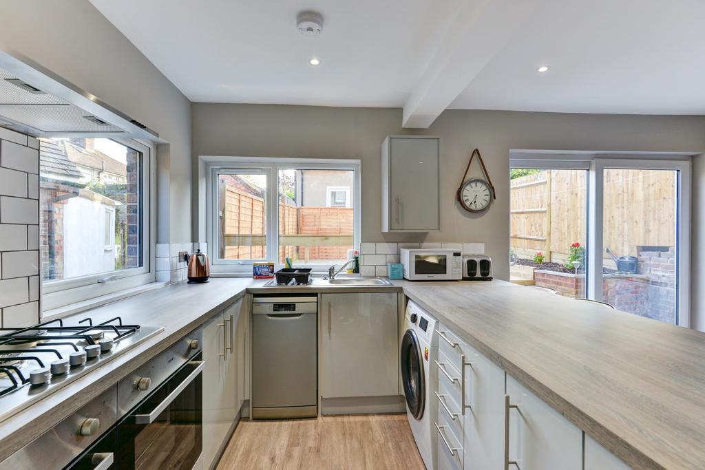 Bright and modern kitchen with ample counter sp...