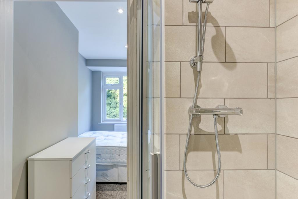 A modern, well-maintained bathroom with a large...