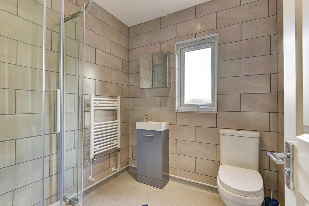 A modern, well-maintained bathroom featuring a ...