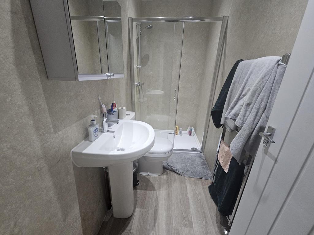A clean and well-maintained bathroom featuring ...