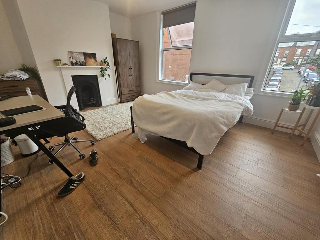 Bright and spacious master bedroom featuring a ...