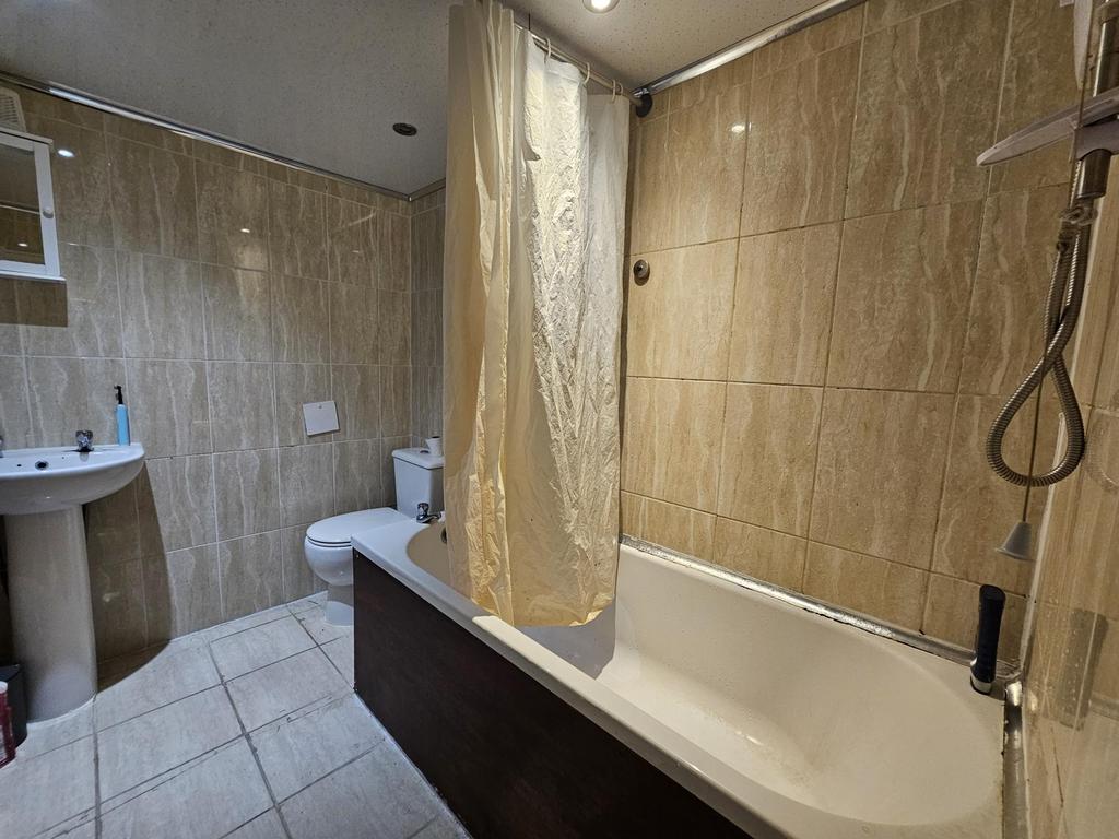 A clean and functional bathroom featuring a bat...