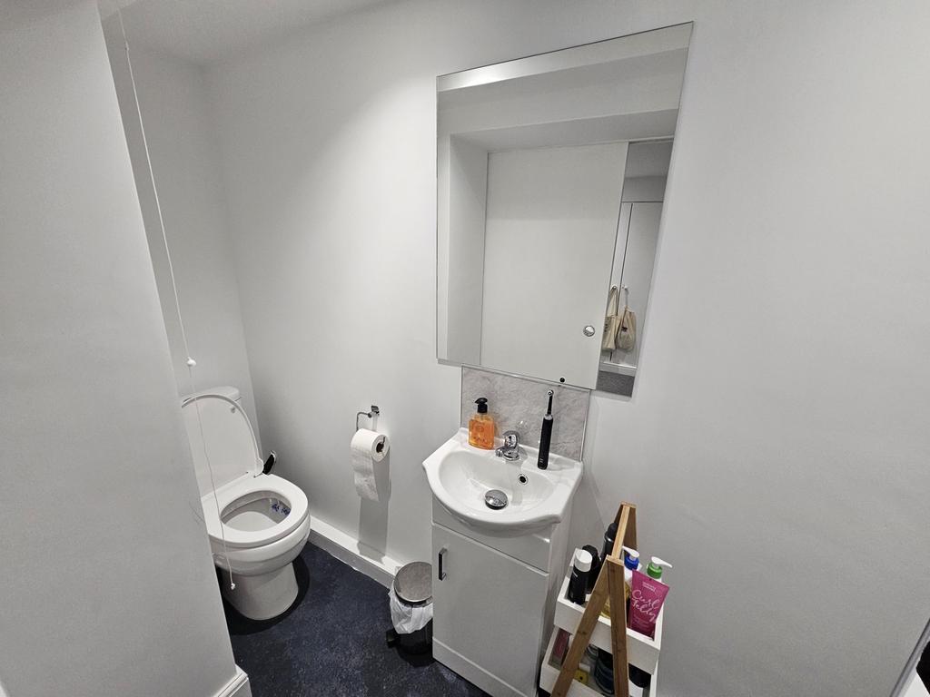A spacious and modern bathroom featuring a larg...