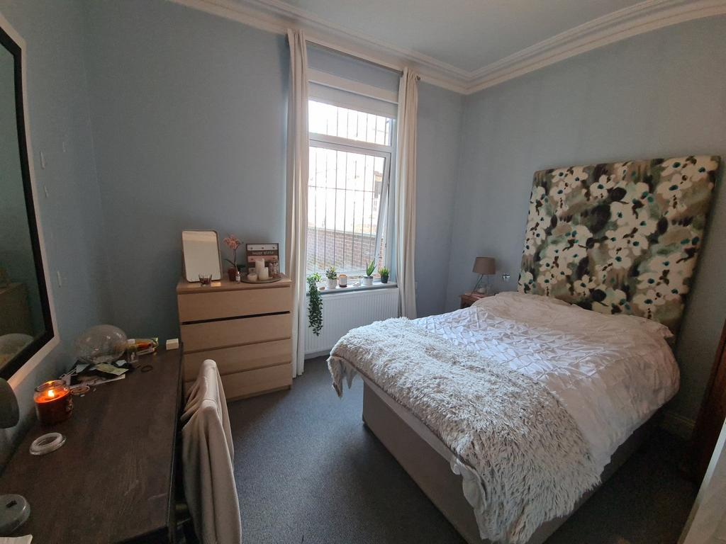 A welcoming bedroom featuring a comfortable dou...