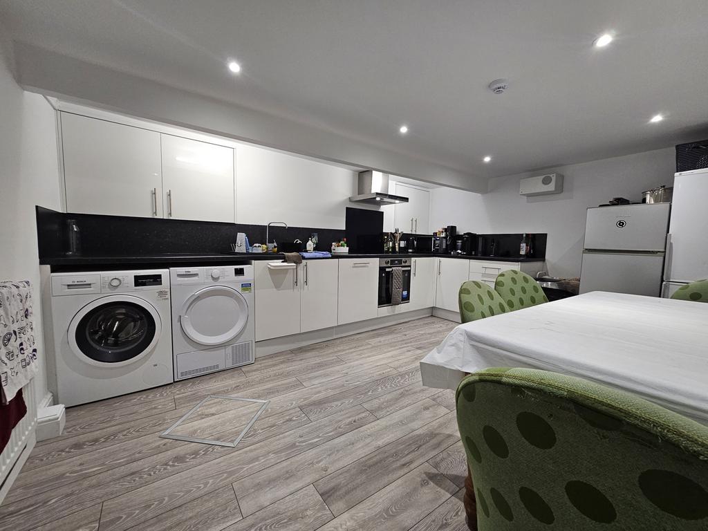 Modern kitchen with ample workspace, featuring ...