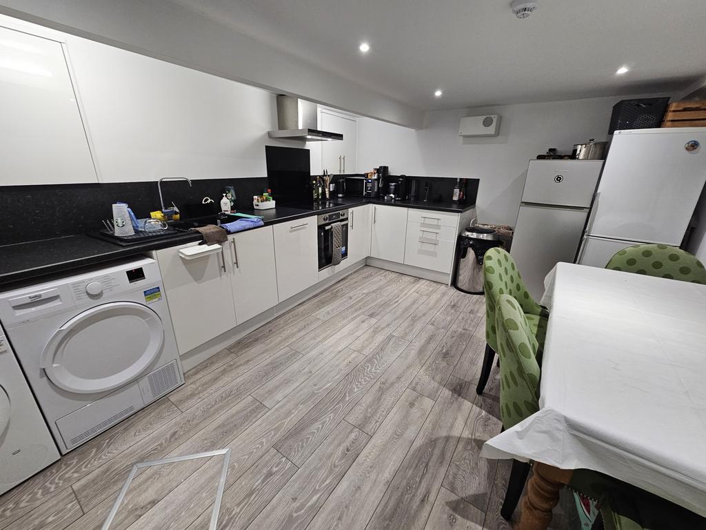 Modern and well-maintained kitchen with sleek w...