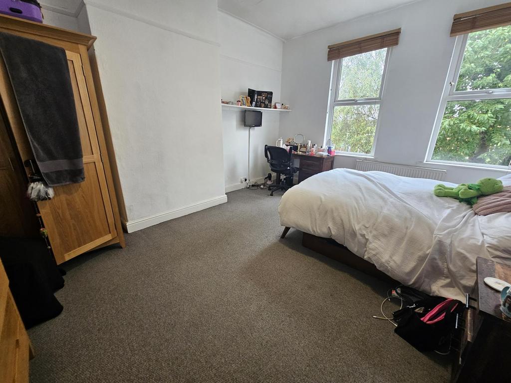 A spacious and well-maintained master bedroom f...