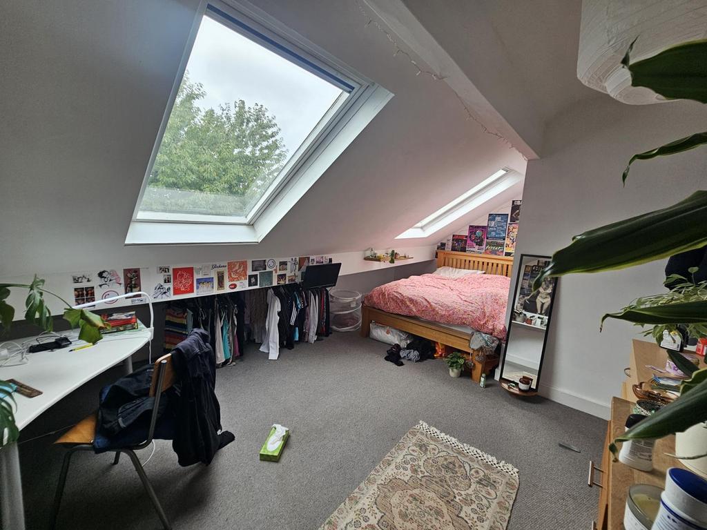 A cozy single bedroom with ample natural light ...