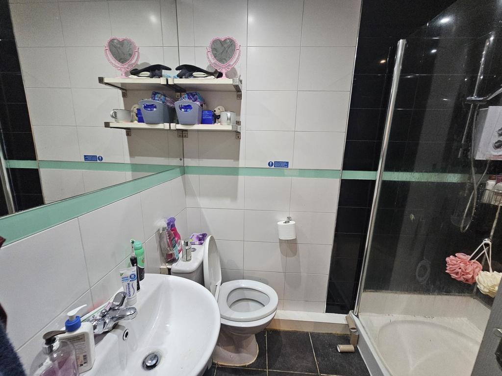 A clean and well-maintained bathroom featuring ...
