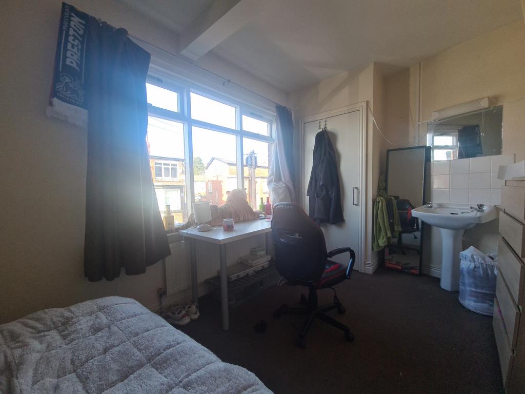 A bright and spacious master bedroom with large...