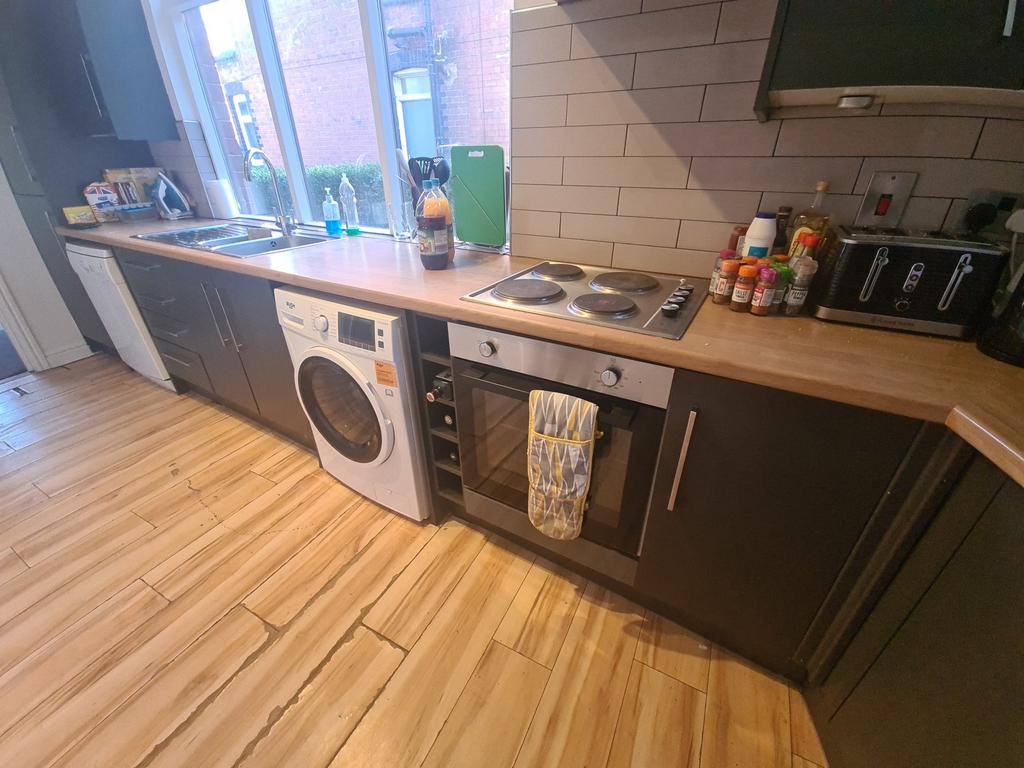 A well-maintained kitchen area featuring modern...