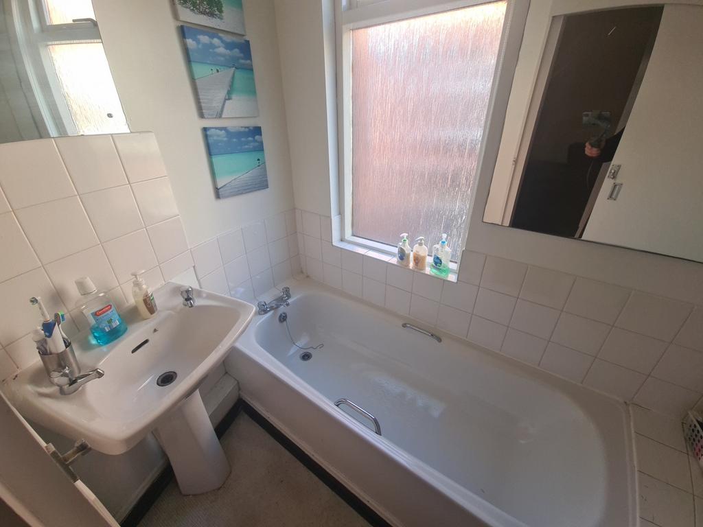 A clean and well-maintained bathroom featuring ...