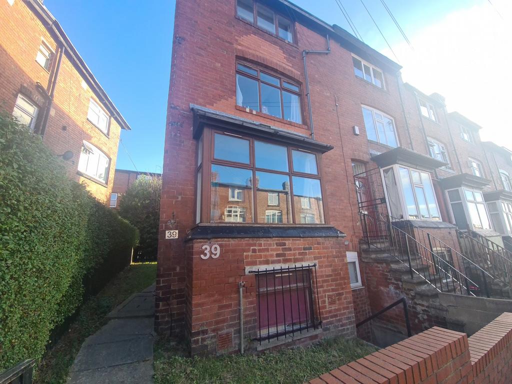 A welcoming front facade of a brick residential...