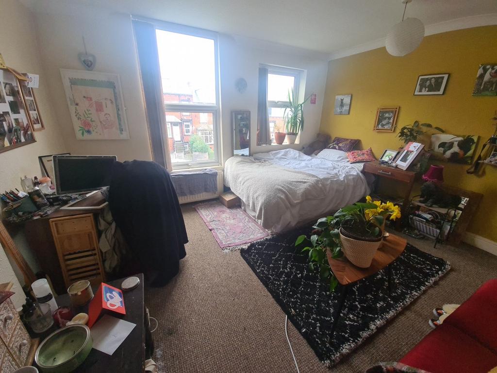 Bright and welcoming living room featuring larg...