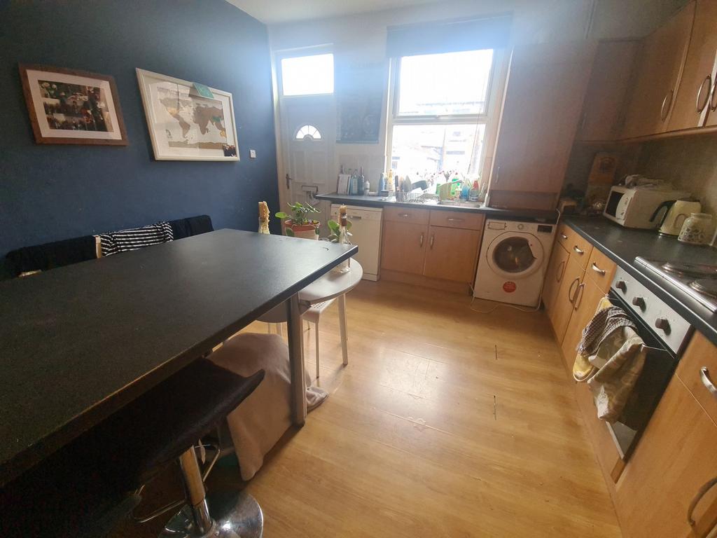 Bright and well-maintained kitchen with ample n...