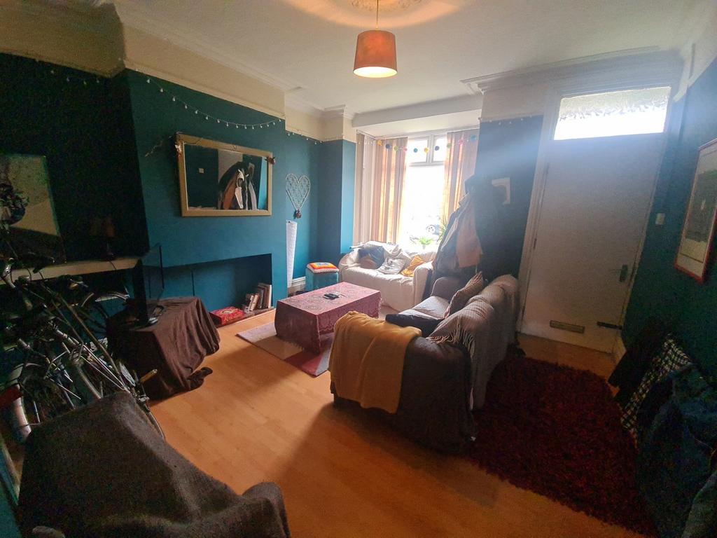 A cozy, well-lit living room with a comfortable...