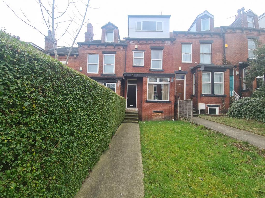 A charming front view of a classic terraced hou...
