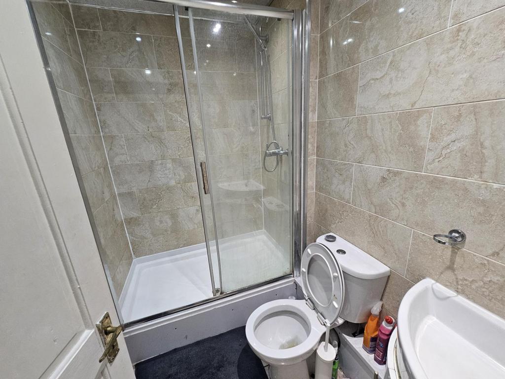 A spacious and modern bathroom featuring a larg...