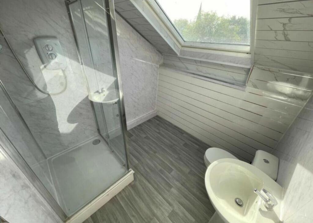 A clean and well-maintained bathroom featuring ...