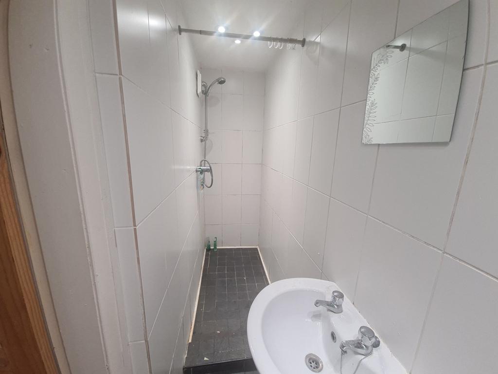 A clean and well-maintained bathroom with a spa...