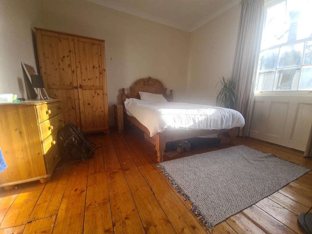 Bright and spacious master bedroom featuring a ...