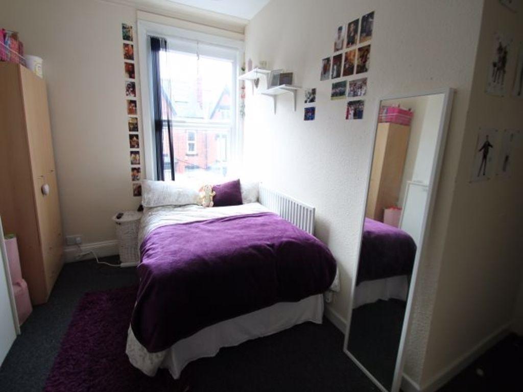 A bright and inviting double bedroom featuring ...