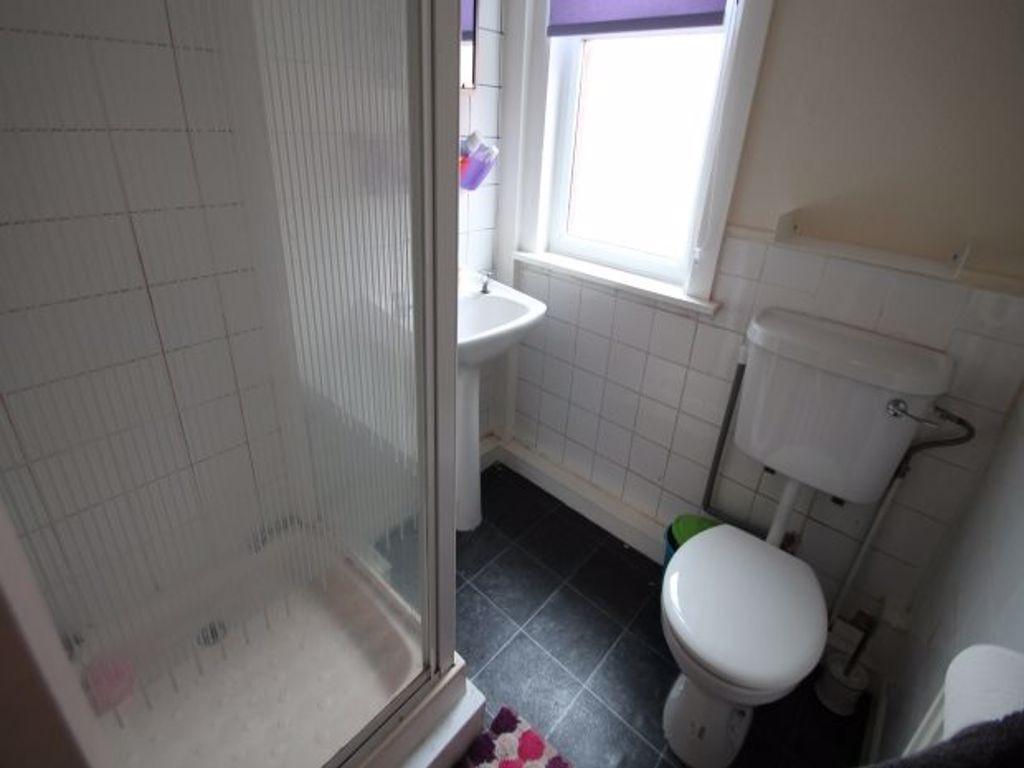 A clean and functional bathroom with a toilet a...