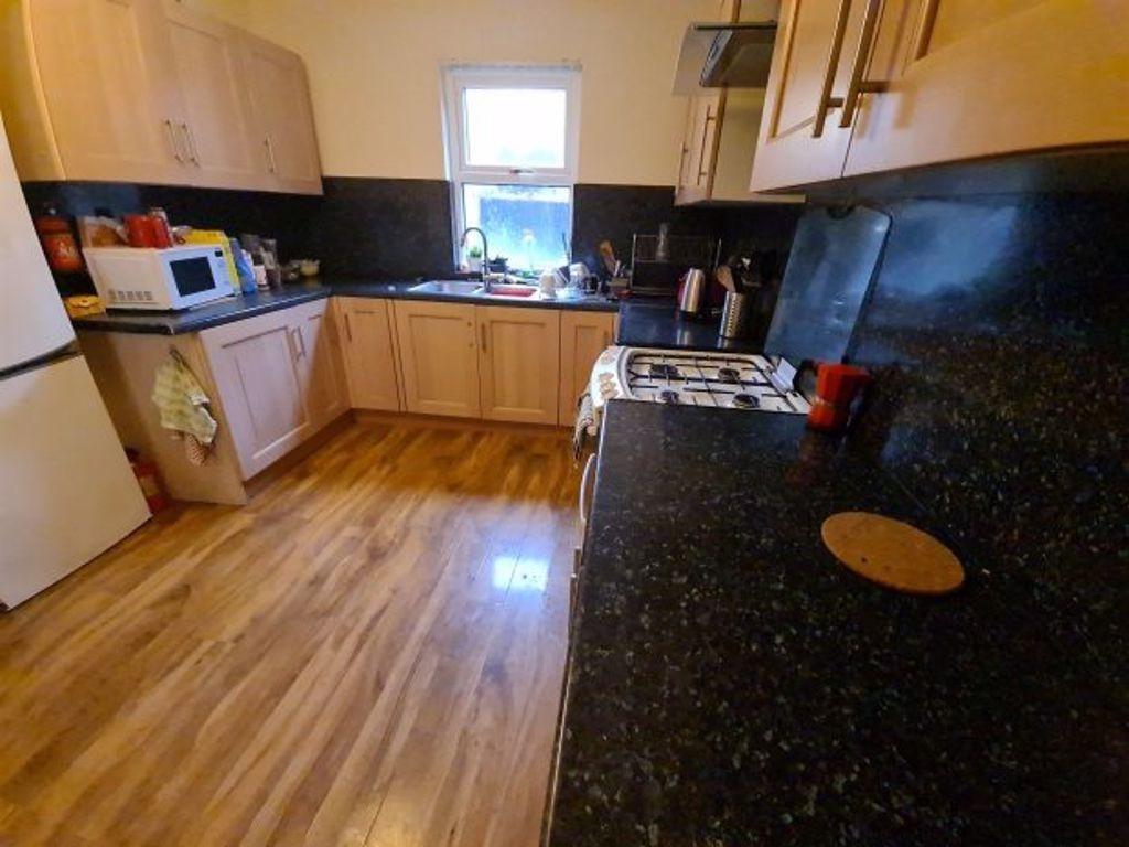 A well-maintained kitchen with natural light st...
