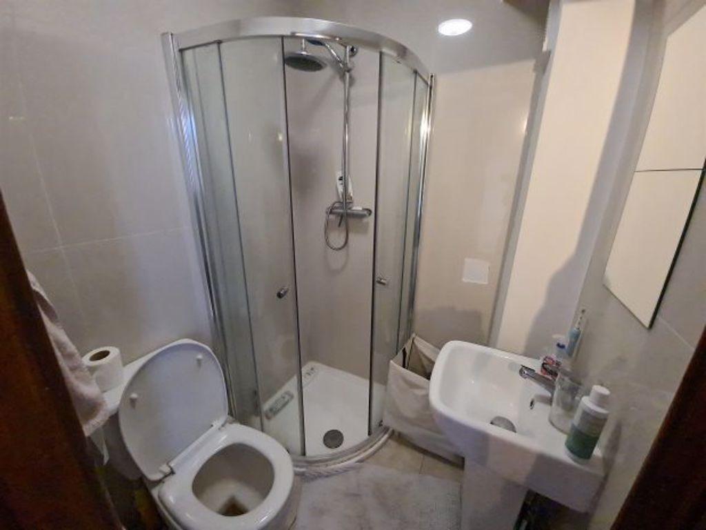 A modern, well-maintained bathroom with a showe...