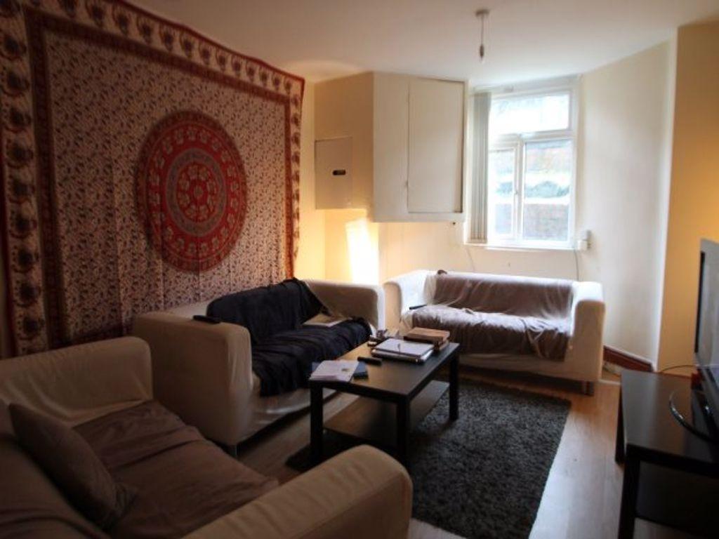 A spacious and inviting living room featuring m...