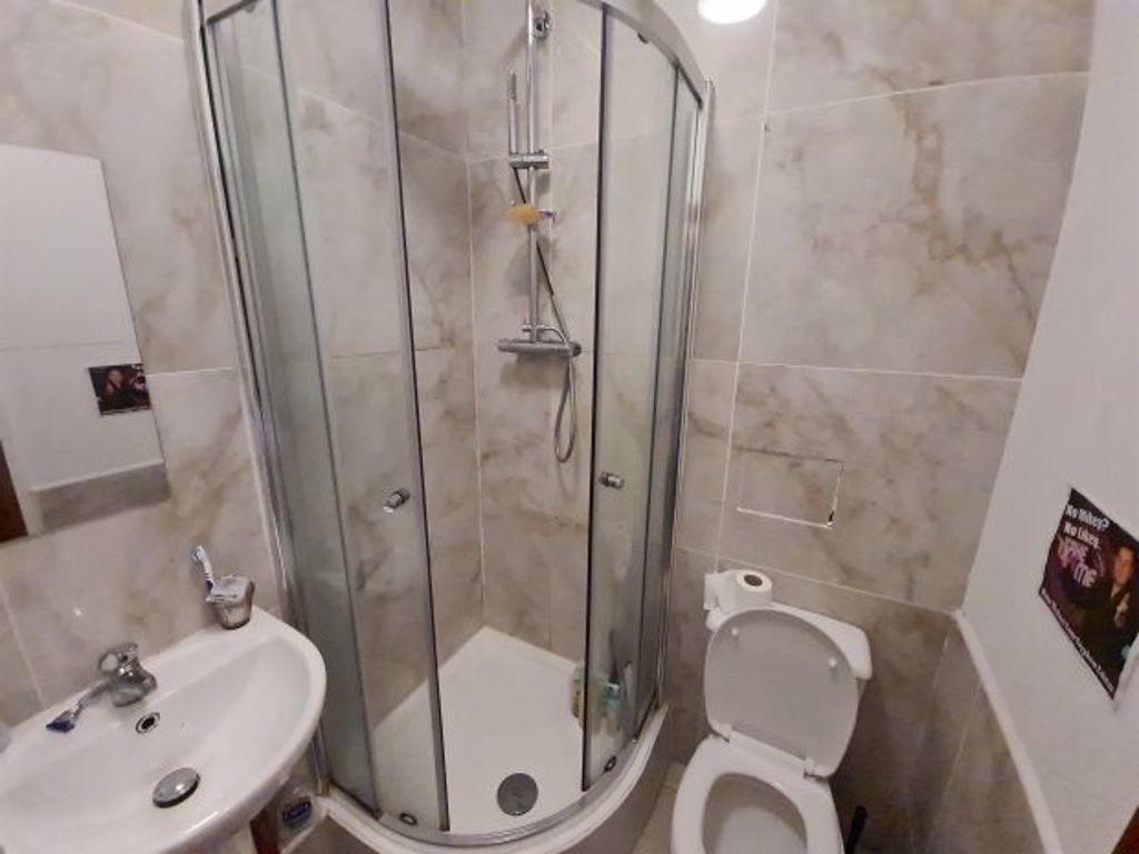 A clean and well-maintained bathroom featuring ...