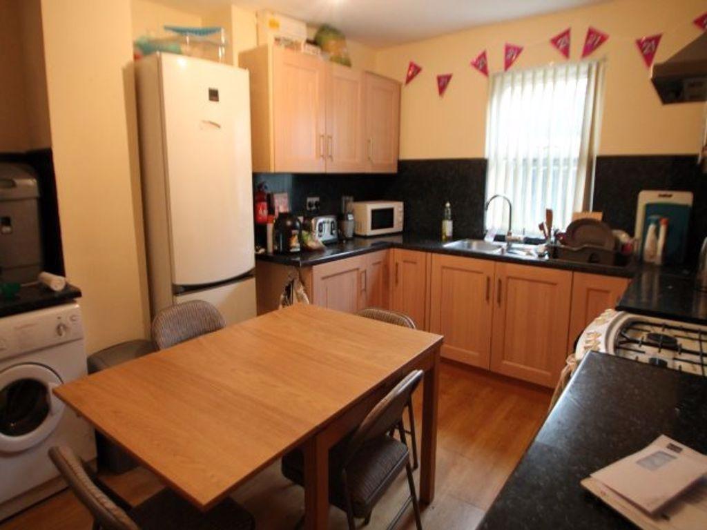 A well-equipped kitchen with plenty of natural ...
