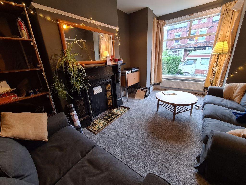 A cozy and inviting living room featuring comfo...