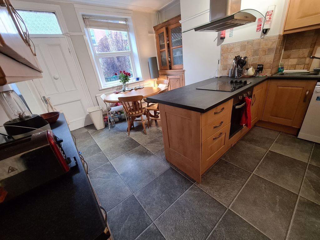 A well-maintained kitchen with ample workspace,...