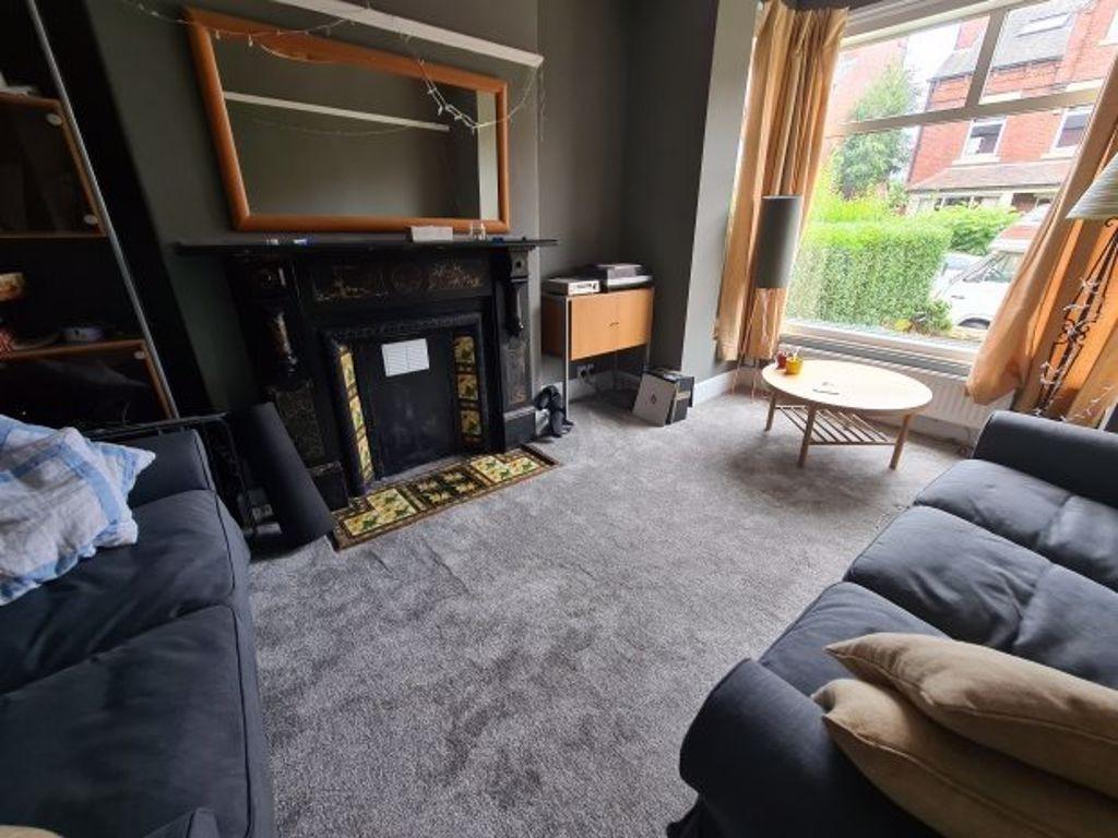 A cozy and well-maintained living room featurin...