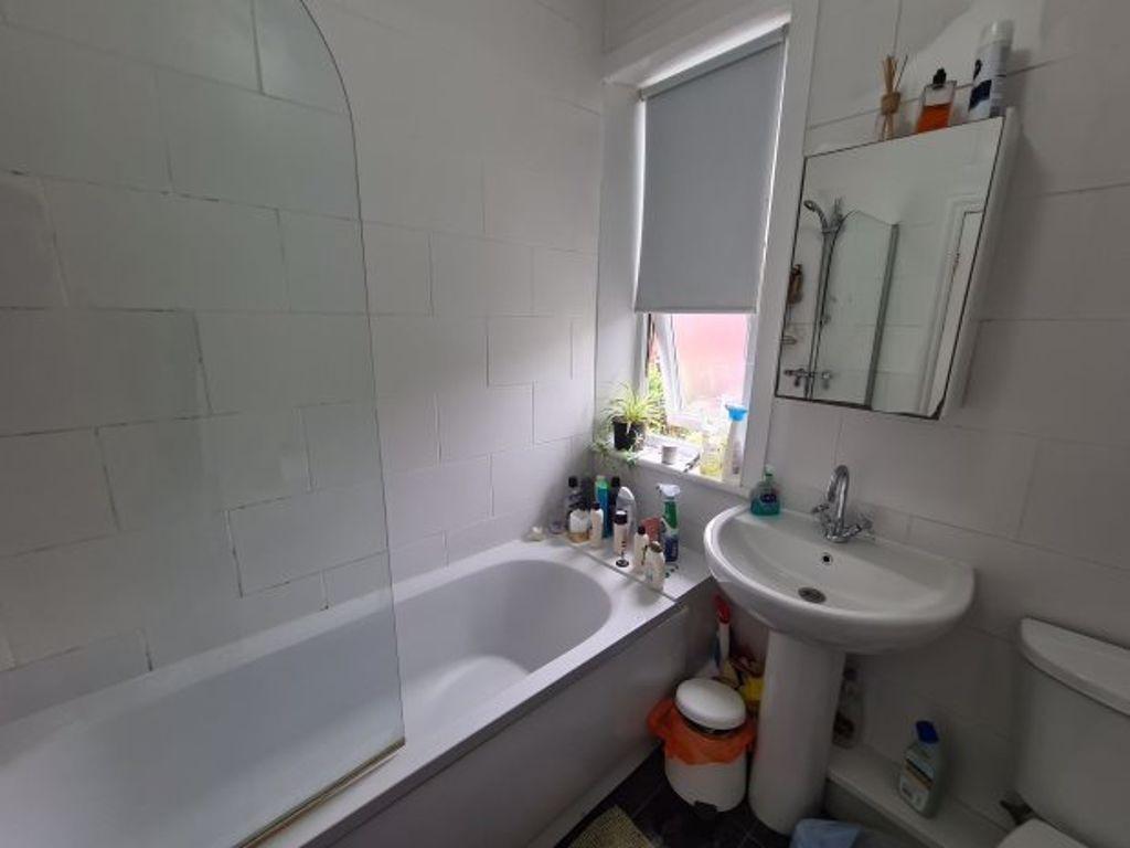 A clean and well-maintained bathroom featuring ...