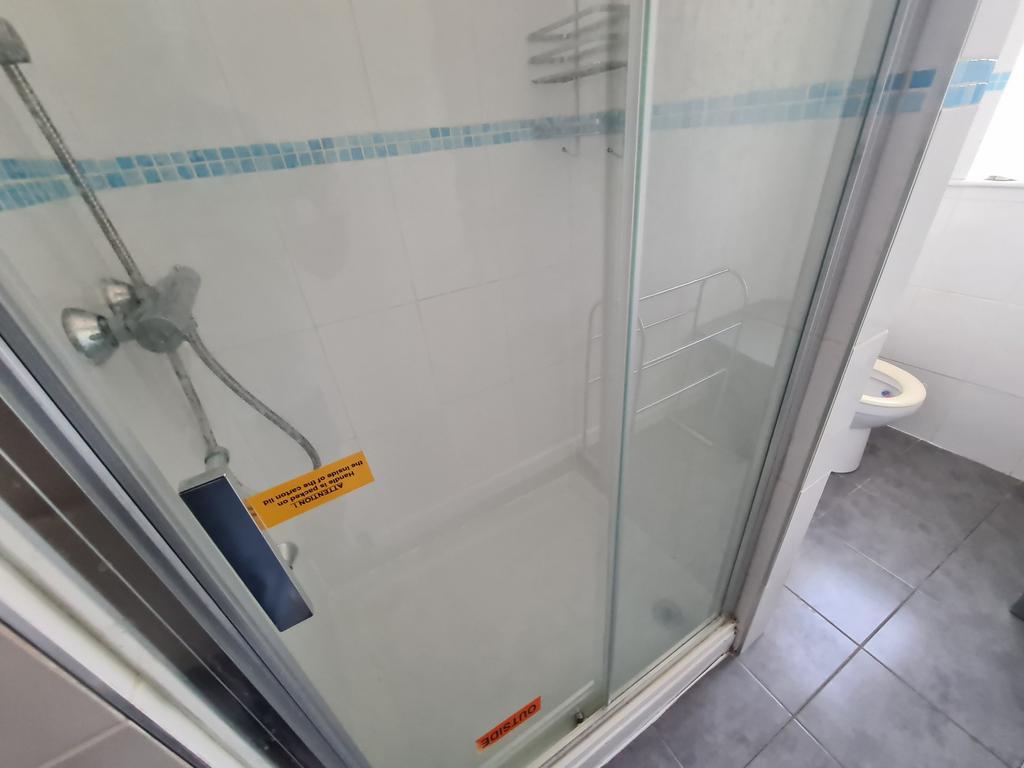 A clean and well-maintained bathroom with a sho...