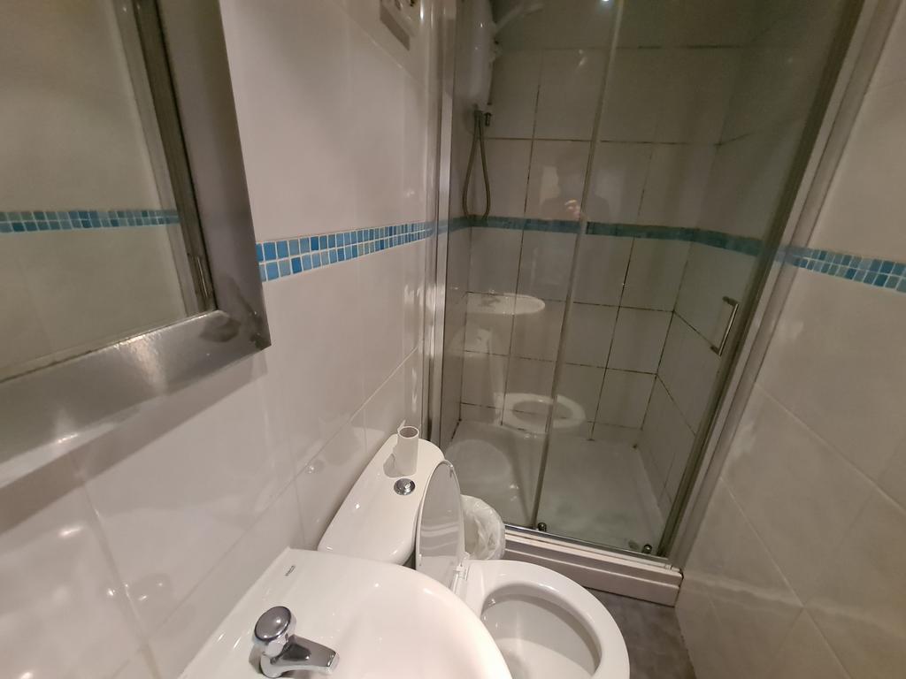 A clean and well-maintained bathroom with a lar...
