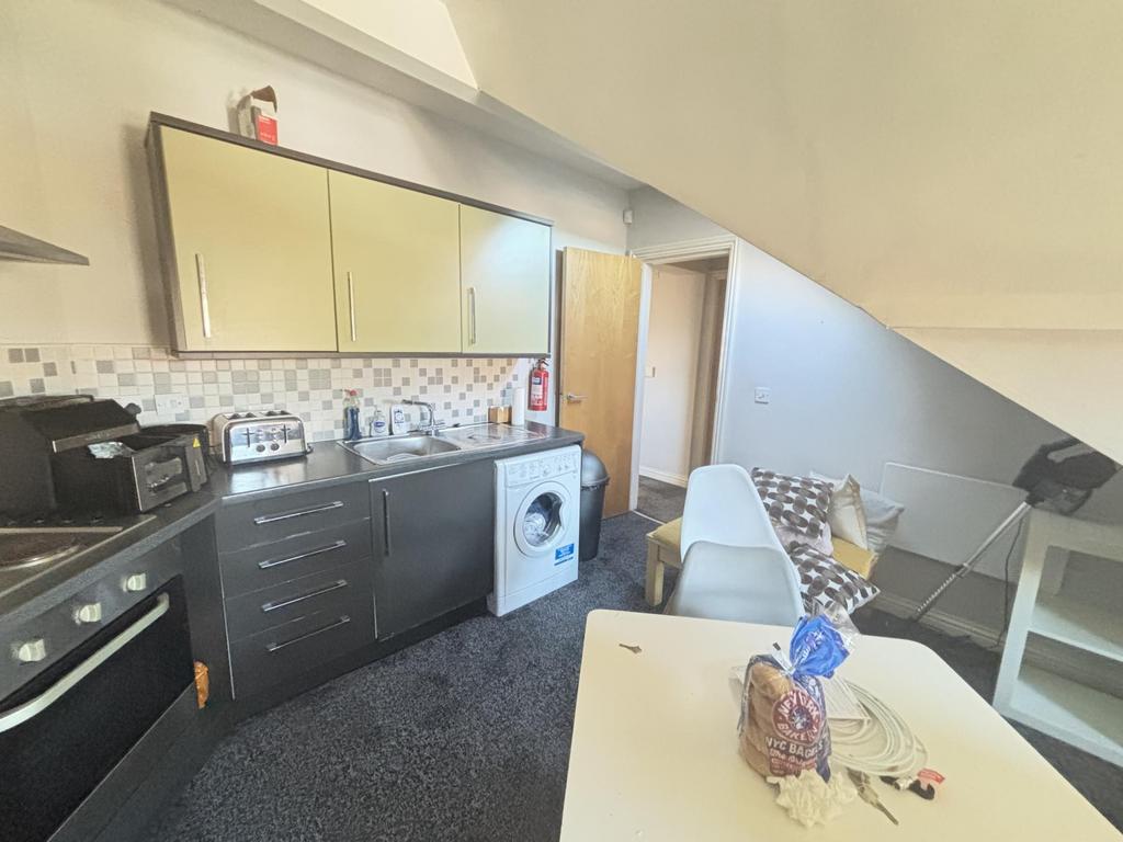 A well-equipped kitchen area featuring modern a...
