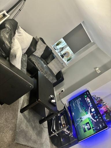 A modern living room featuring a large flat-scr...