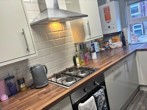 Modern kitchen area with ample countertop space...