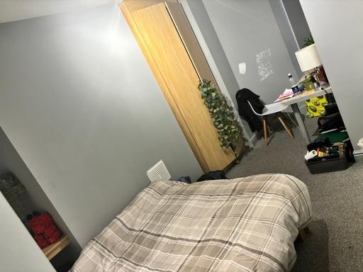 A compact bathroom featuring a toilet, with som...